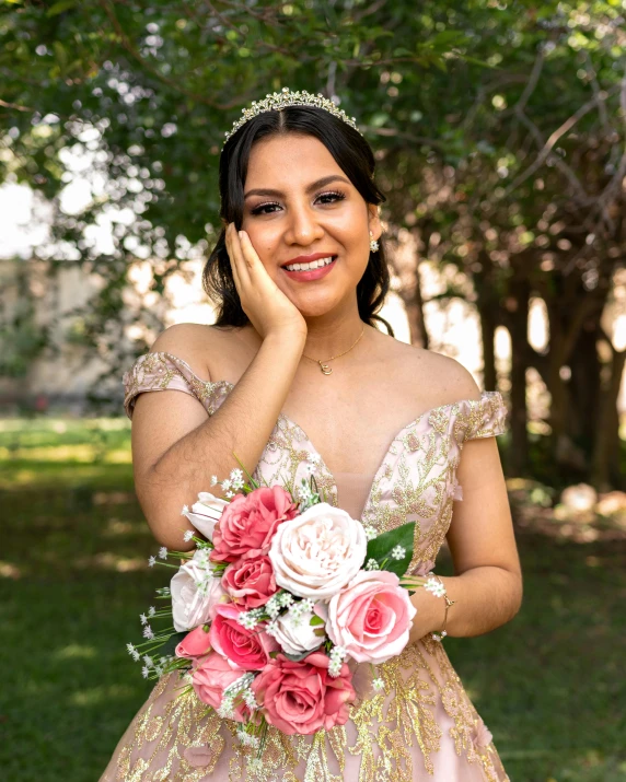 a woman in an off the shoulder dress poses for a po