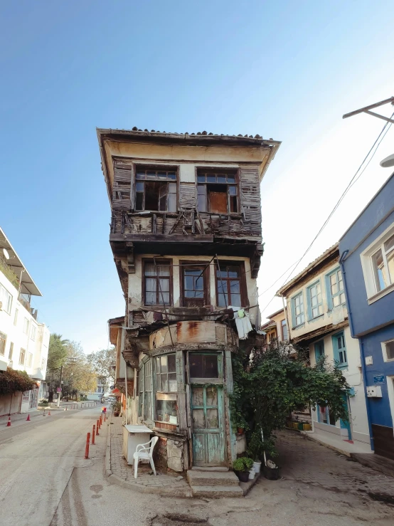 a street scene with an old building and a bench