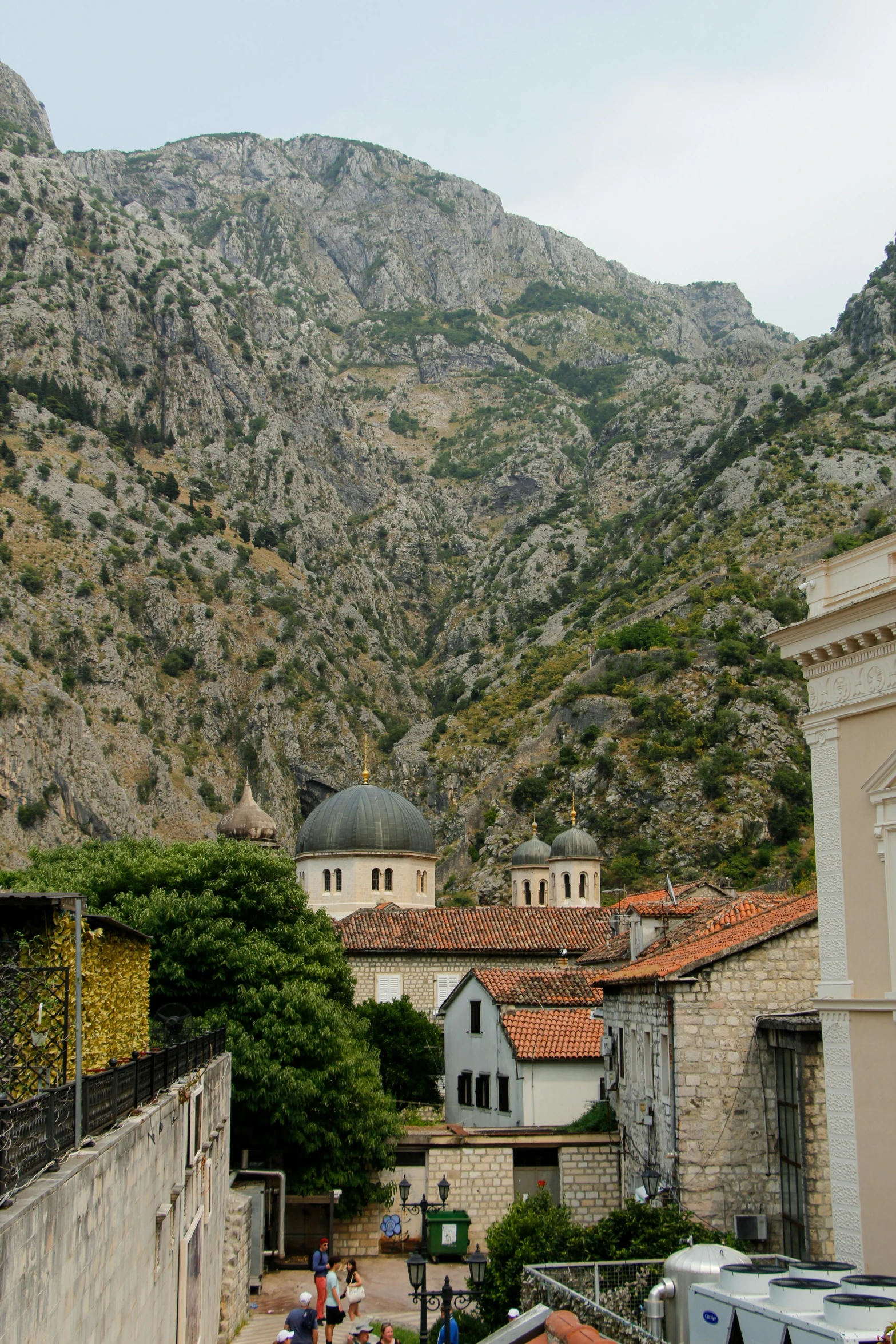 the village is surrounded by mountains and buildings