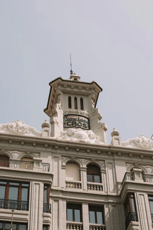 an old building with a clock on the side of it