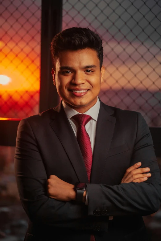 a man in a suit smiling at the camera