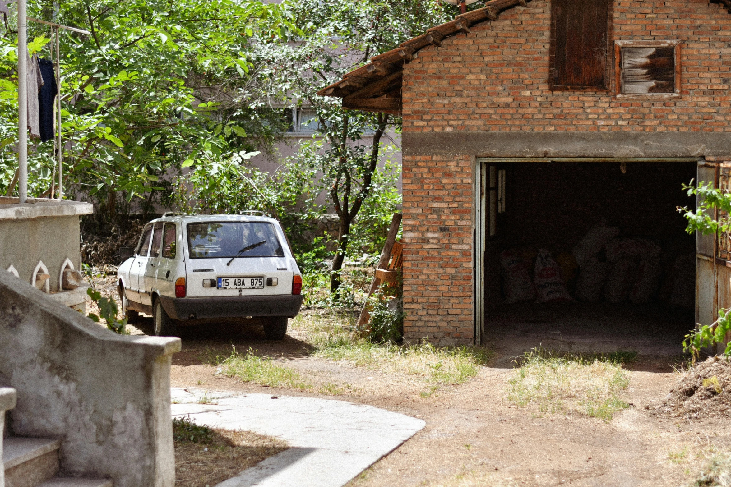 a truck is parked next to an old brick house