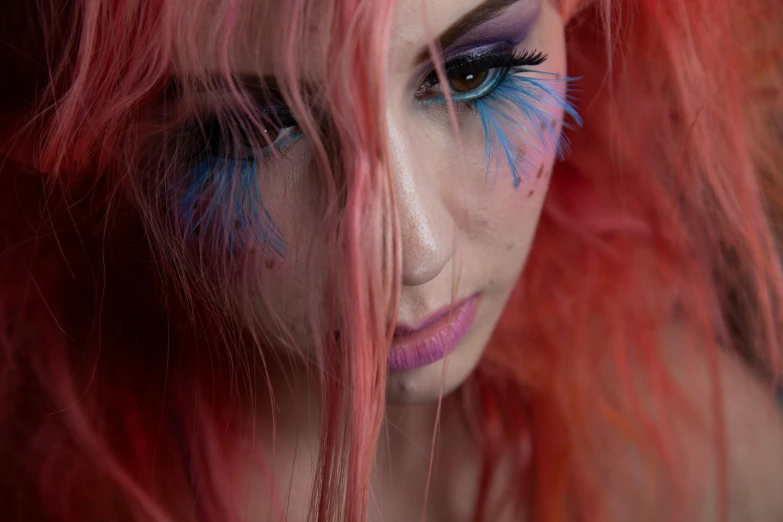 a close up of a person with red hair