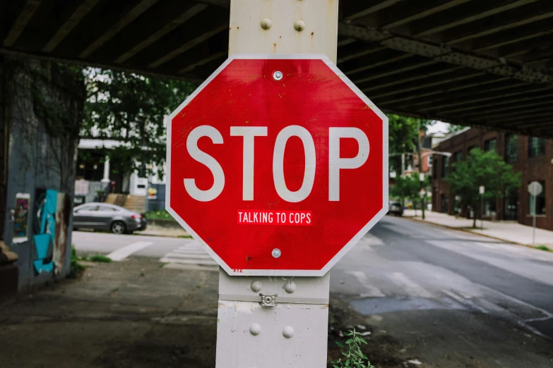 a stop sign is posted on the corner of the street