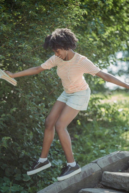 a little girl doing tricks on a skateboard