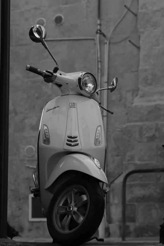 a scooter parked in front of a building