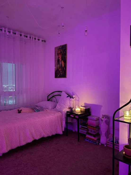 a room with purple lighting and a bed