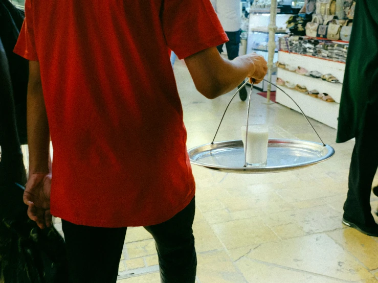 a man is walking towards an empty basket