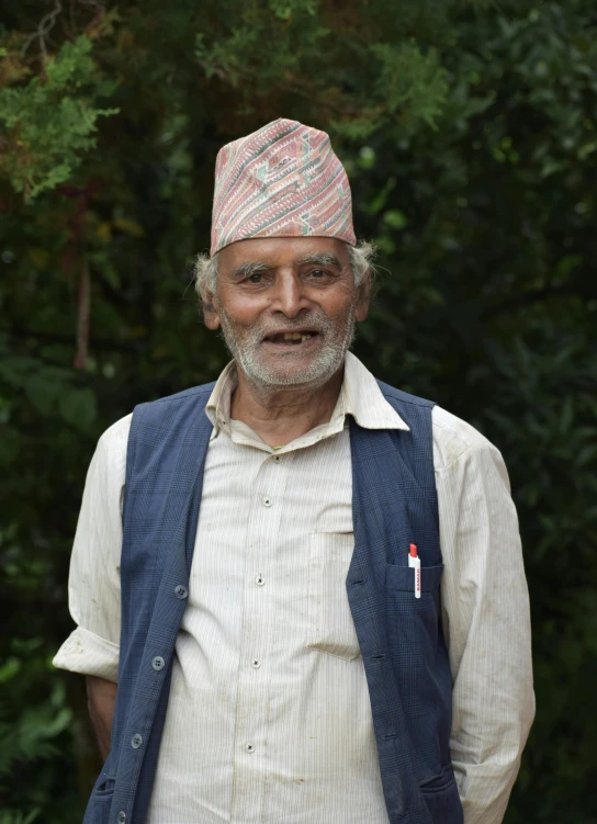 a close up of a person wearing a hat and vest