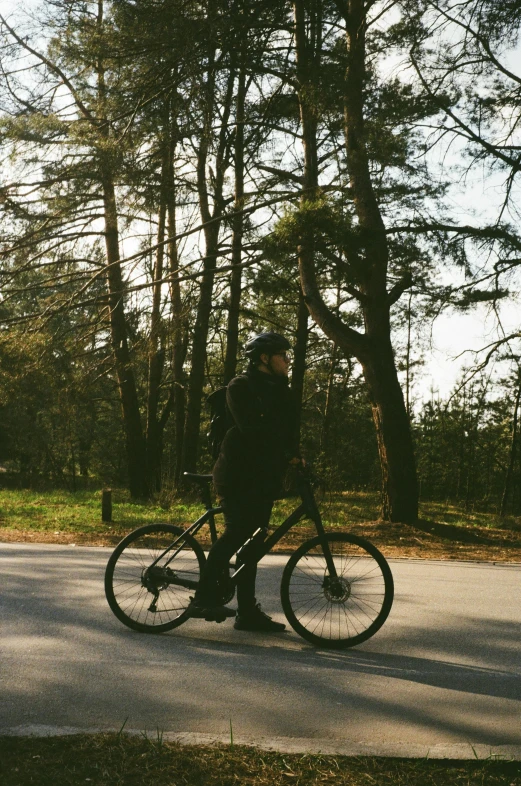 a person is riding a bike in the woods