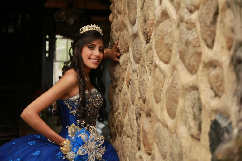 a  in a blue dress is posing