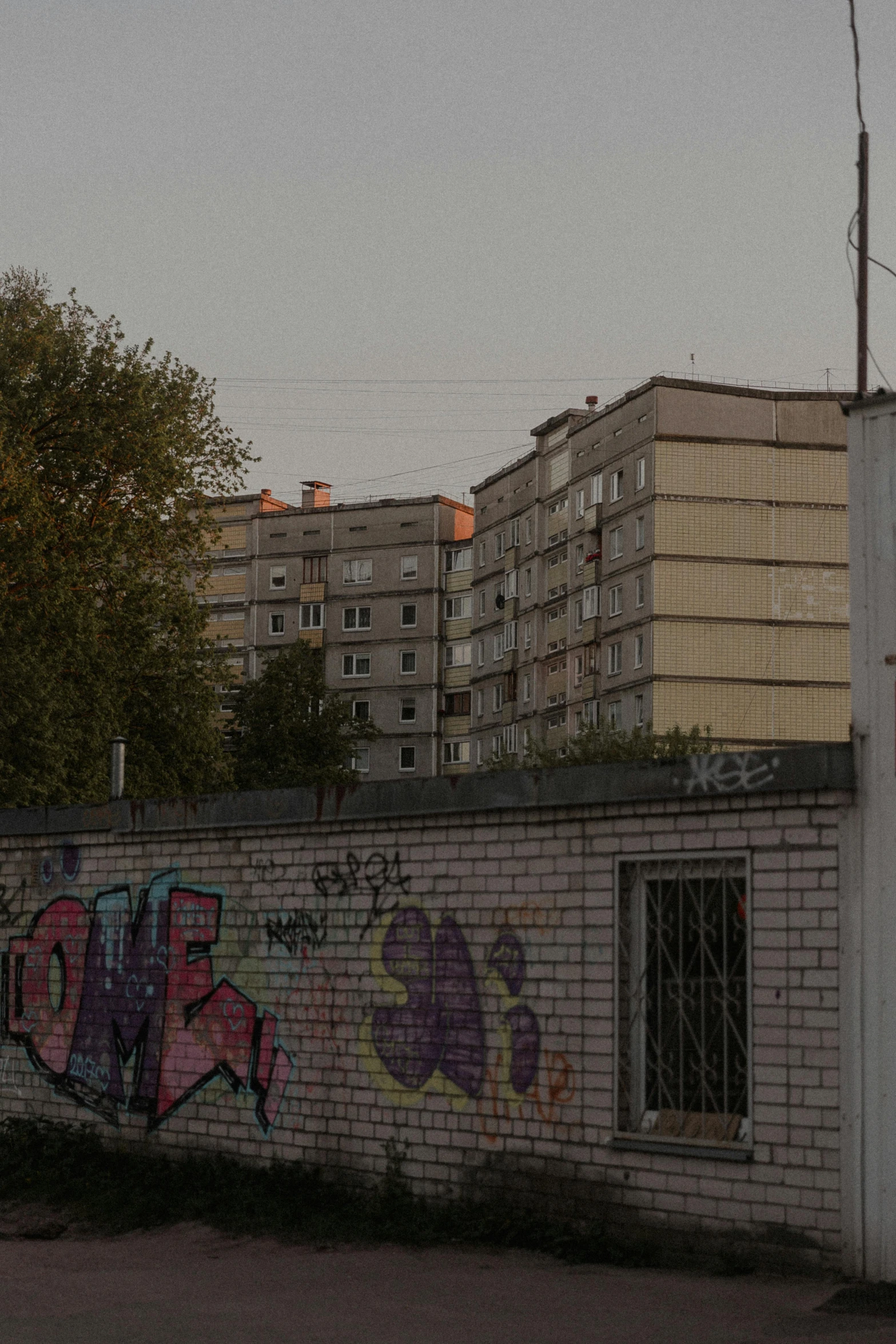 graffiti is covering the entire wall of this building