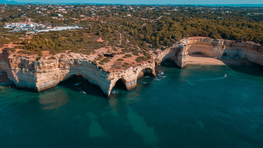 aerial view of a large natural formation with water