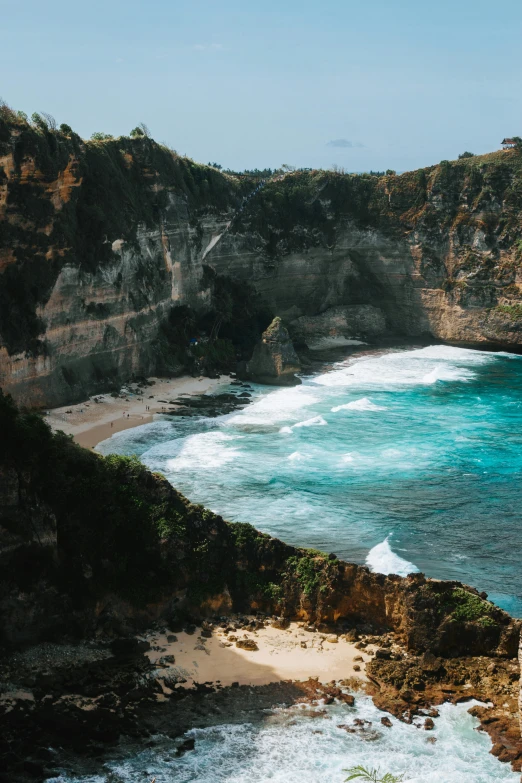 an ocean cliff that is overlooking the beach