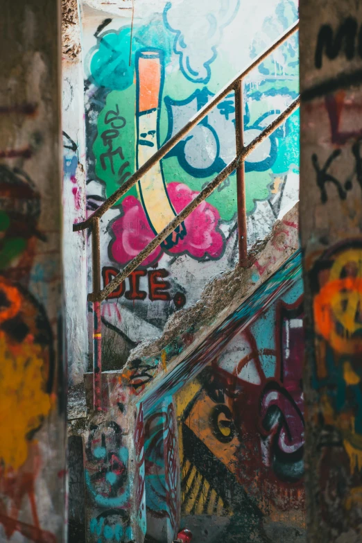 stairs are decorated with graffiti in this graffitied staircase
