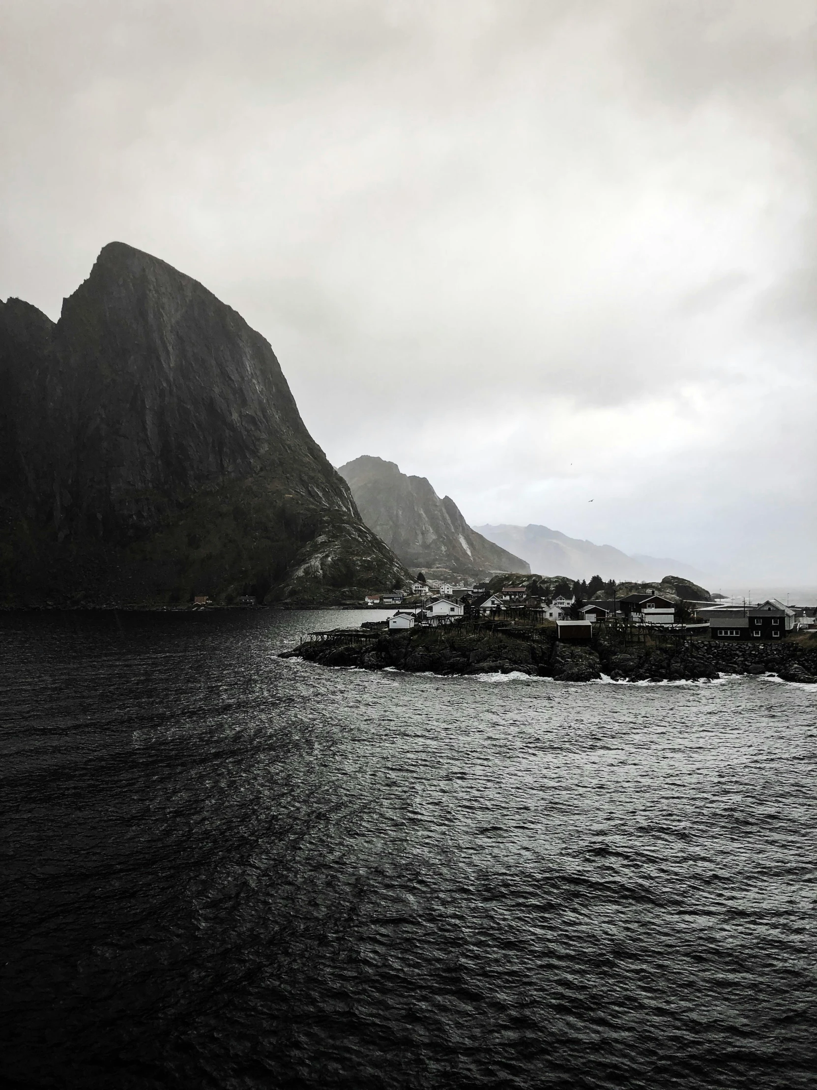 a view of the mountains with a body of water near it