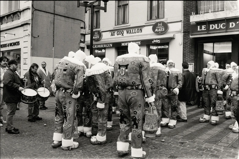 the parade features large, patterned elephants standing in a row