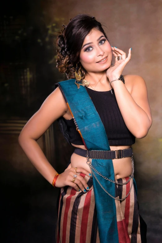 an indian girl in a colorful sari looks into the camera