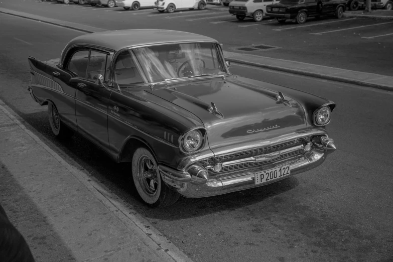 a classic black and white po of an old car