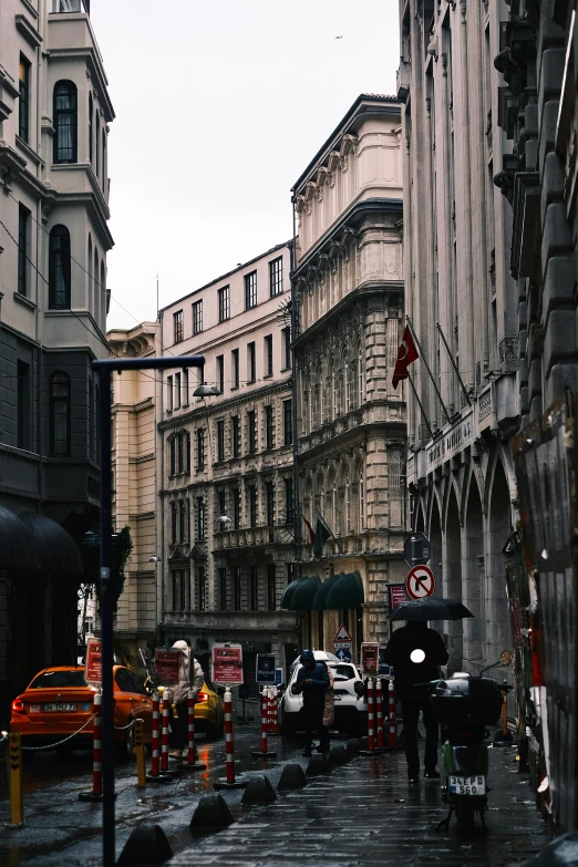 a group of traffic cones on a rainy street