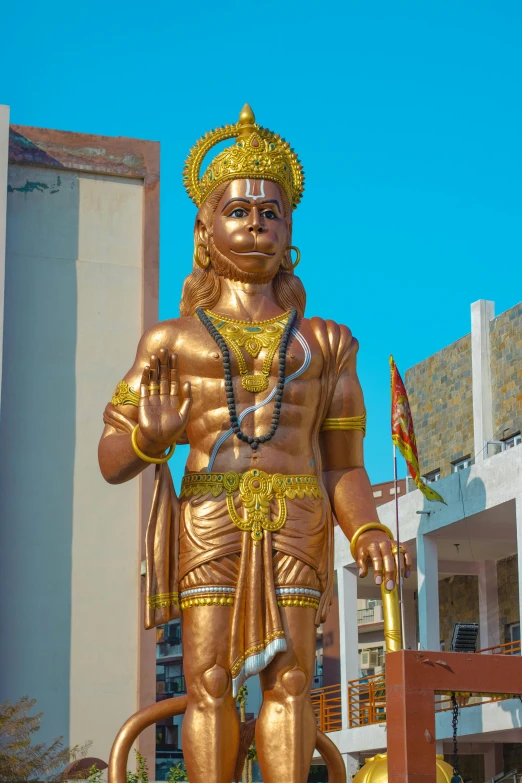 a statue of lord rama with a golden finish