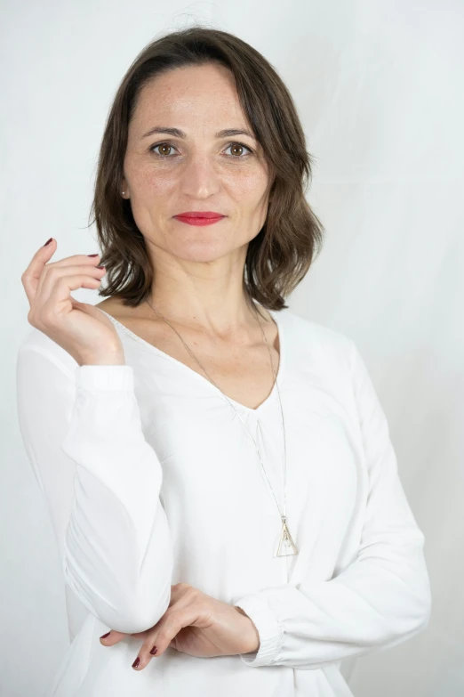 a woman is posing for a po and posing with her hand on the hip