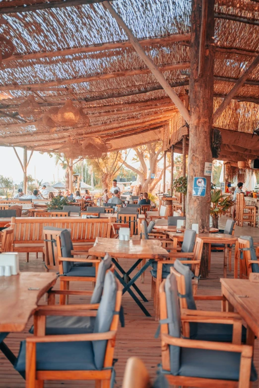 there are many chairs and tables in the restaurant