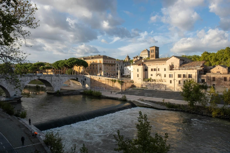 the view from across the river shows many buildings and water