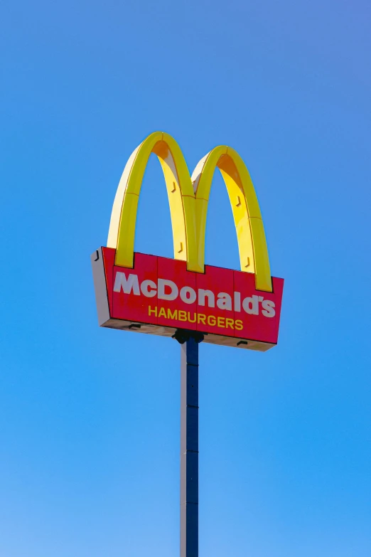 a large mcdonald's sign on top of a pole