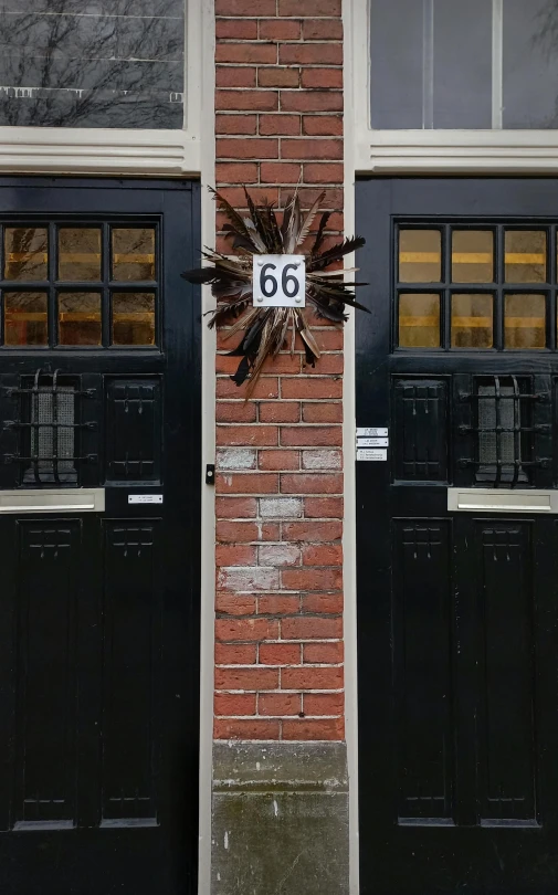 the entrance to a building decorated with a clock