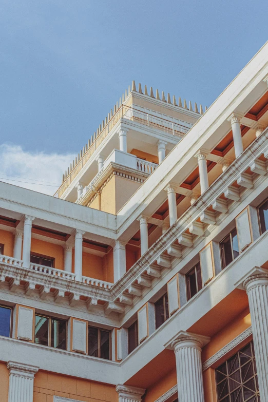 an upward view of a white building