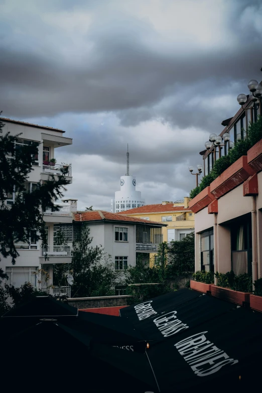 a rooftop with a view of buildings and a steeple