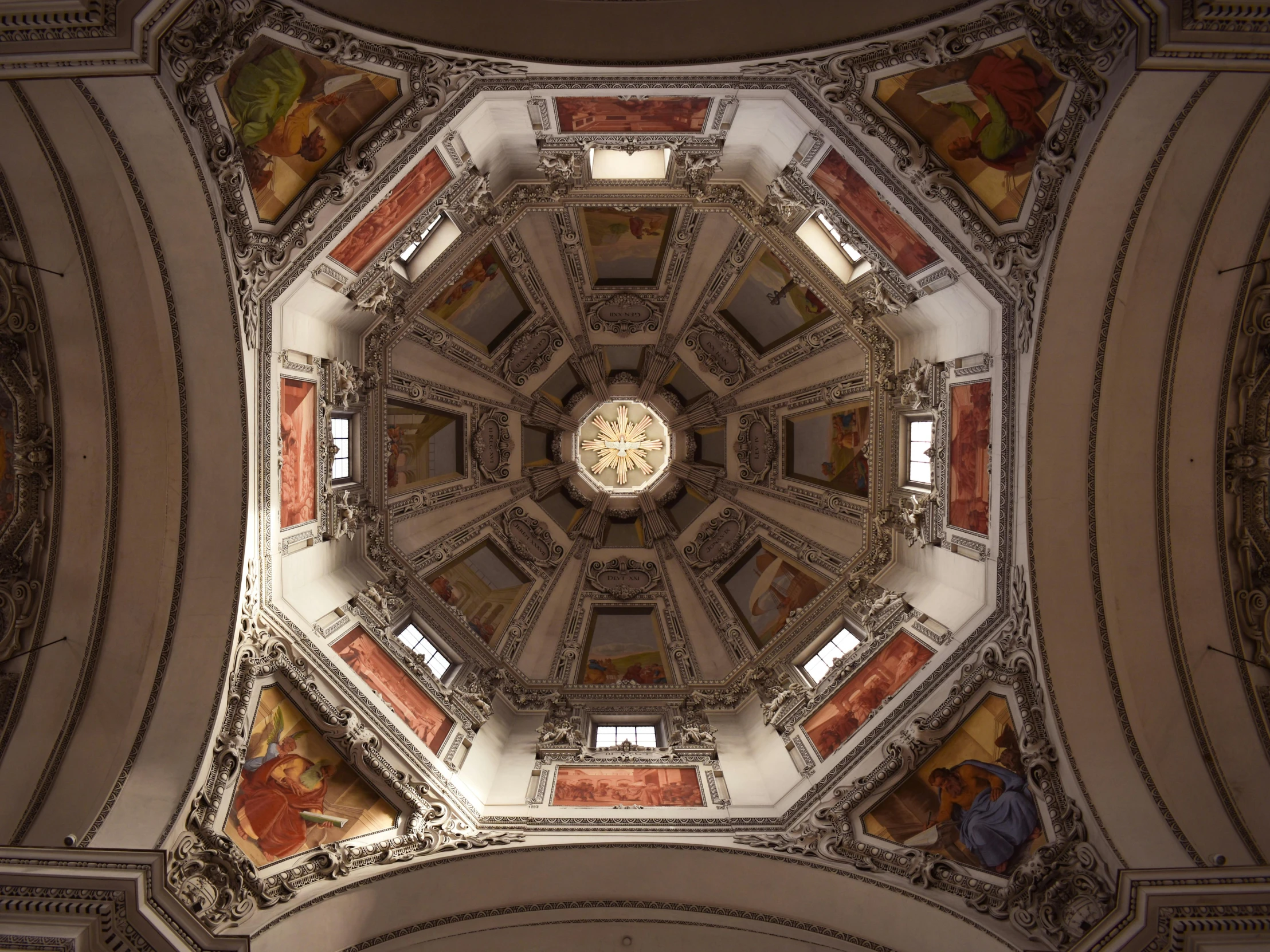 the ceiling of an ornate building has been decorated with murals