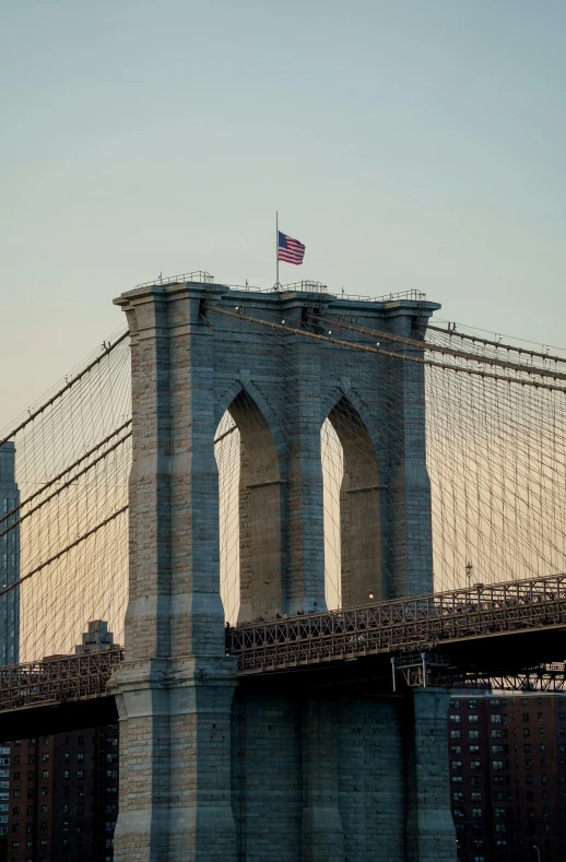 an image of a city bridge with a flag in the middle