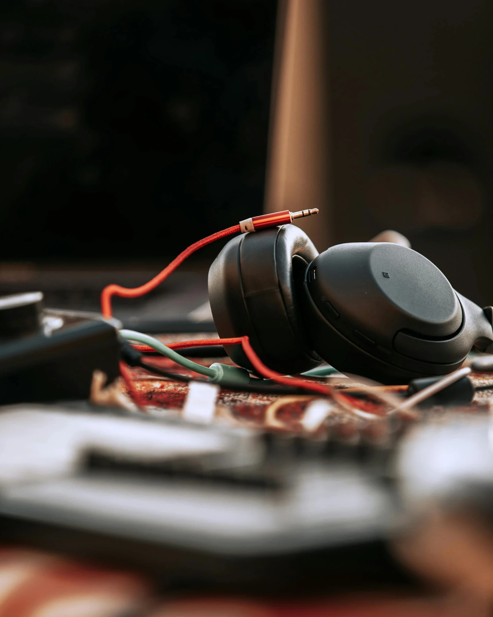 some black headphones sitting on some wires