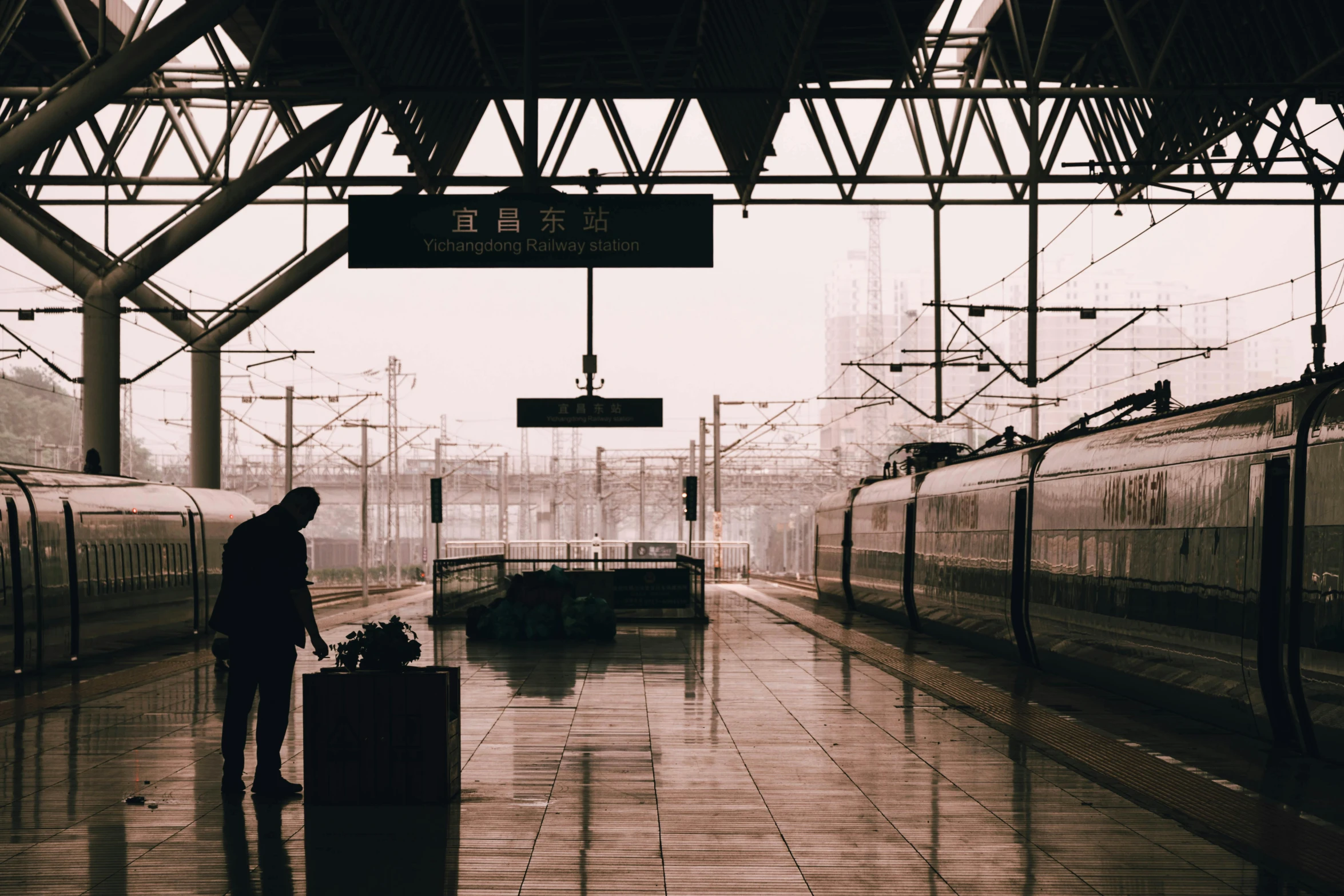 man waiting for a train at the station