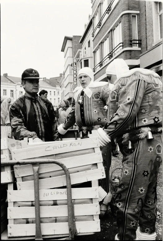 a group of men who are standing around a table