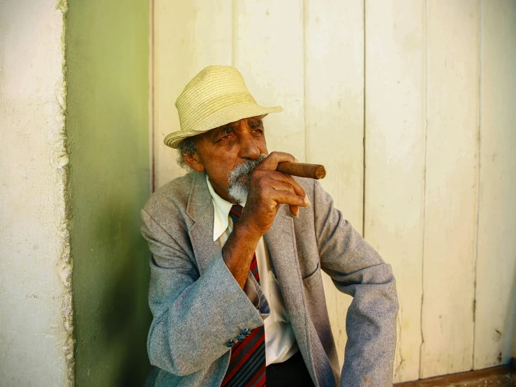 a man in a hat playing a pipe