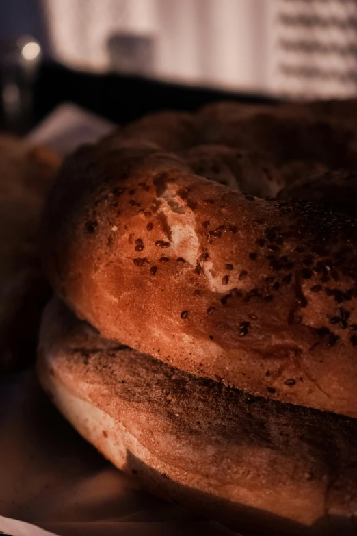 a close up po of a bread with sesame seeds on top