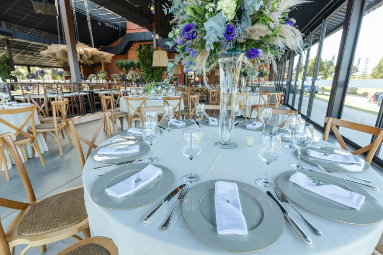 a table is set for an event with glassware