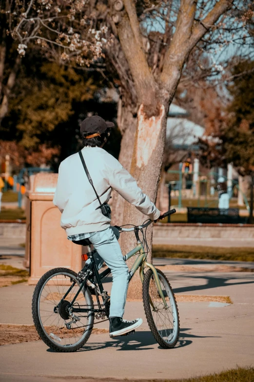 a person on a bike looking at the park