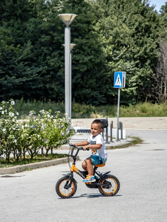 a young person is riding on a bike