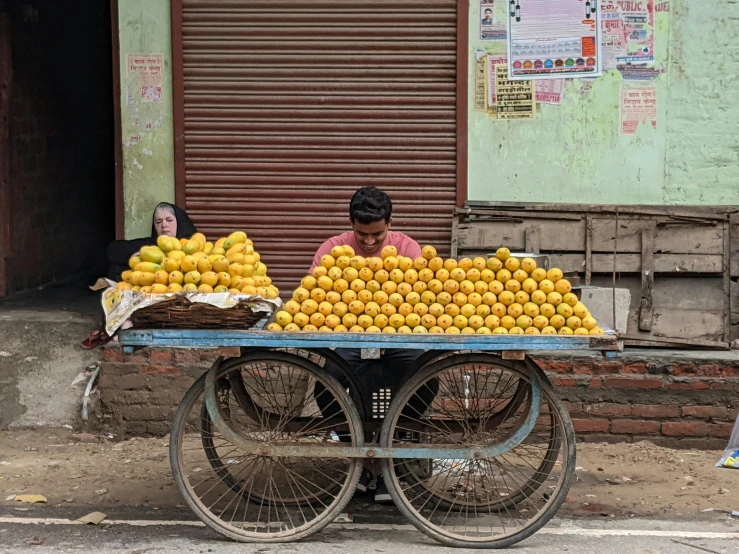 a cart is loaded with lemons in the street