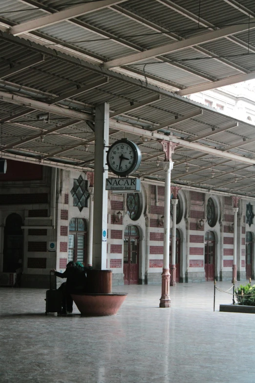 the large clock is on top of the pillar