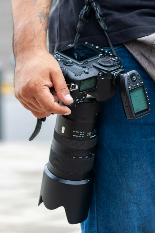 a person holding a camera with both hands