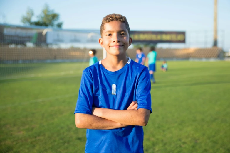 the  is posing on the soccer field