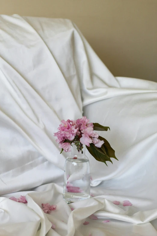 a flower arrangement sitting inside of a glass vase