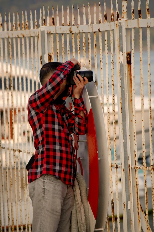 a man taking pictures of his reflection in the mirror