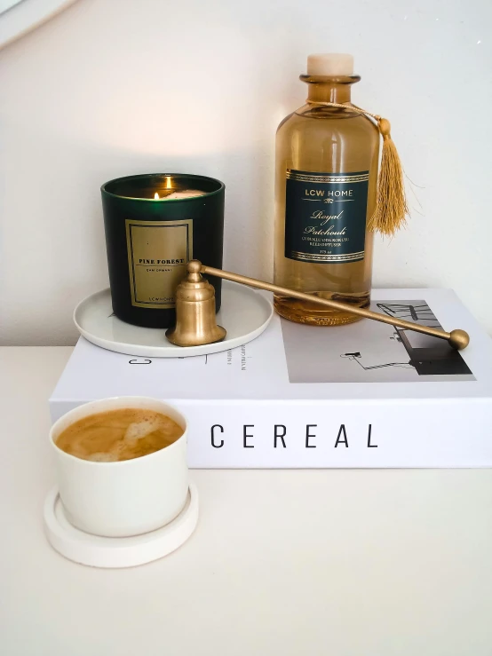 a white table with candles and a book