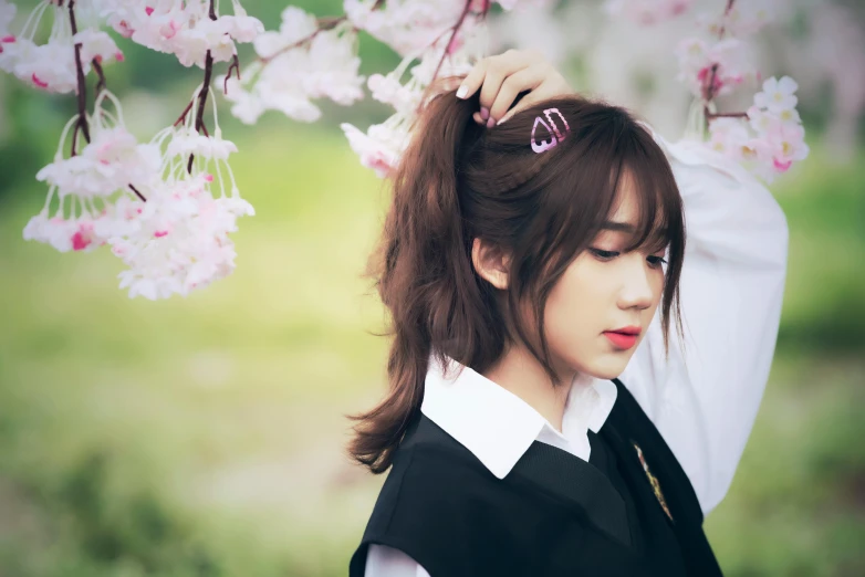 a girl with an umbrella looking into the distance with flowers behind her